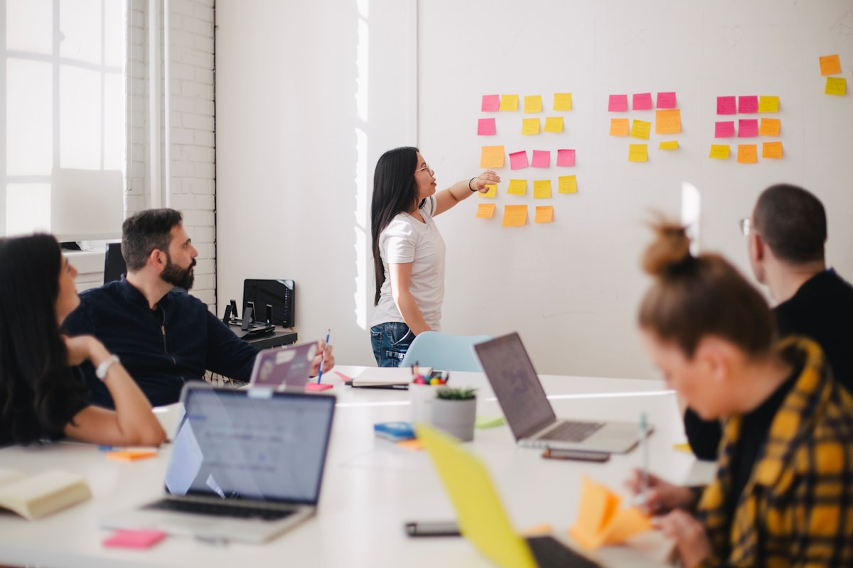 A team of professionals in a process analysis meeting — representing the service providers who sit between citizens and government and use AI to improve their advisory work