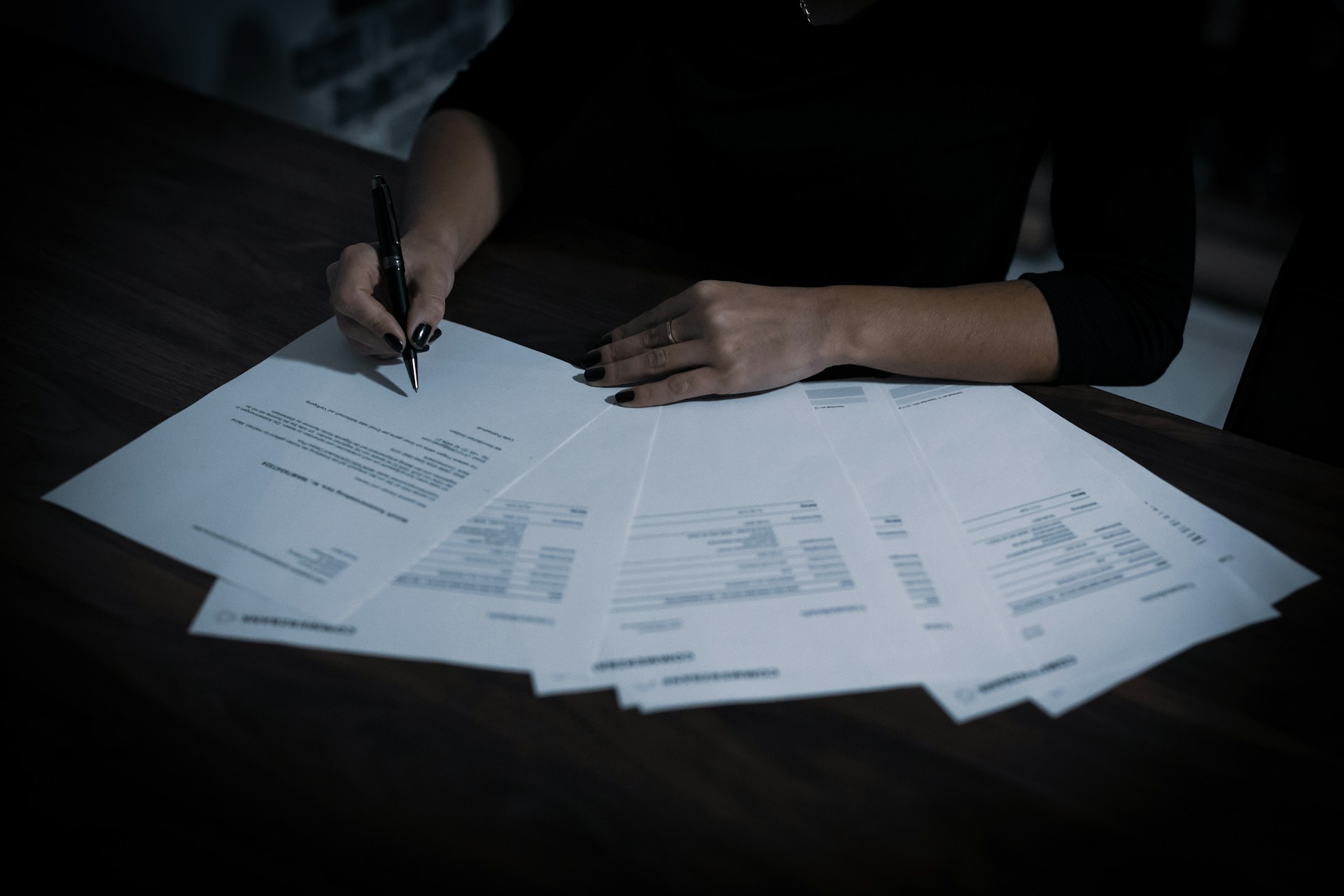 Business professional conducting supplier KYC verification checking trade license and documents representing the UAE FTA required supplier identity verification process from October 2026