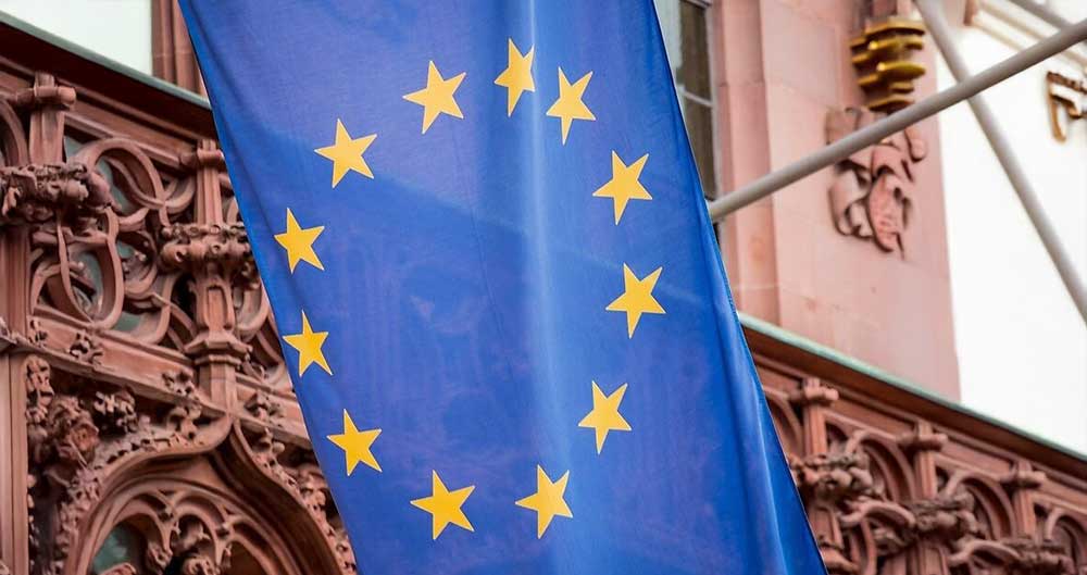 European city skyline representing residency by investment programs in Malta, Spain, Portugal, Latvia and Turkey — pathways to EU residence that are very different from Caribbean citizenship by investment
